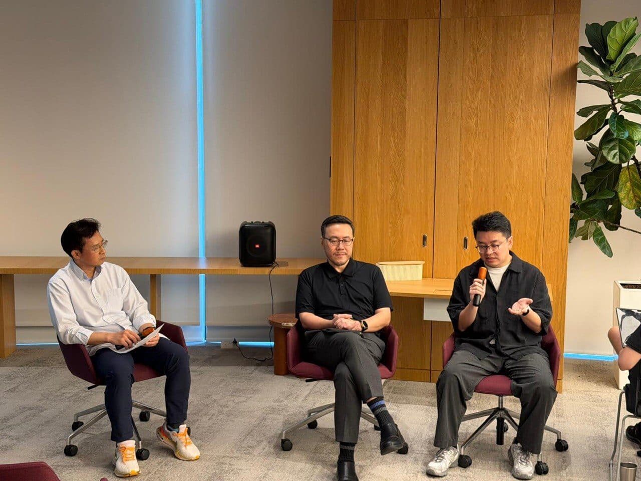 The fireside chat following the report launch, with three speakers seated in discussion