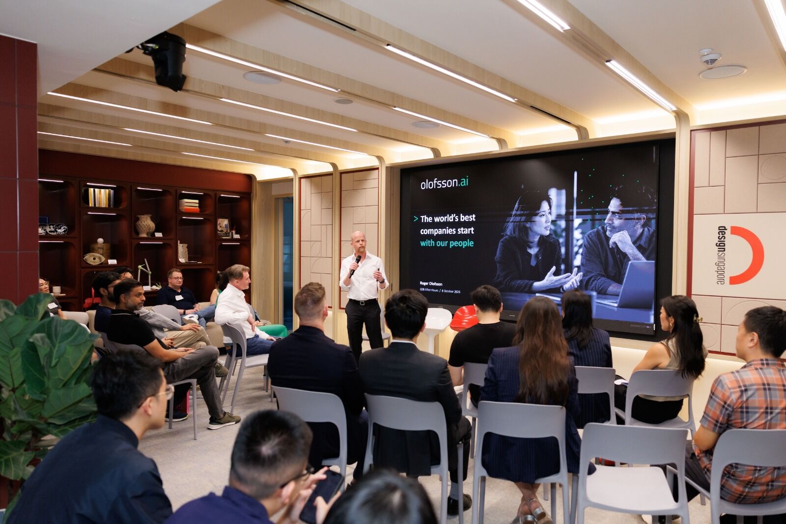 Roger Olofsson presenting to a seated audience at the EDB After-Hours AI talent networking evening in Singapore, 8 October 2026