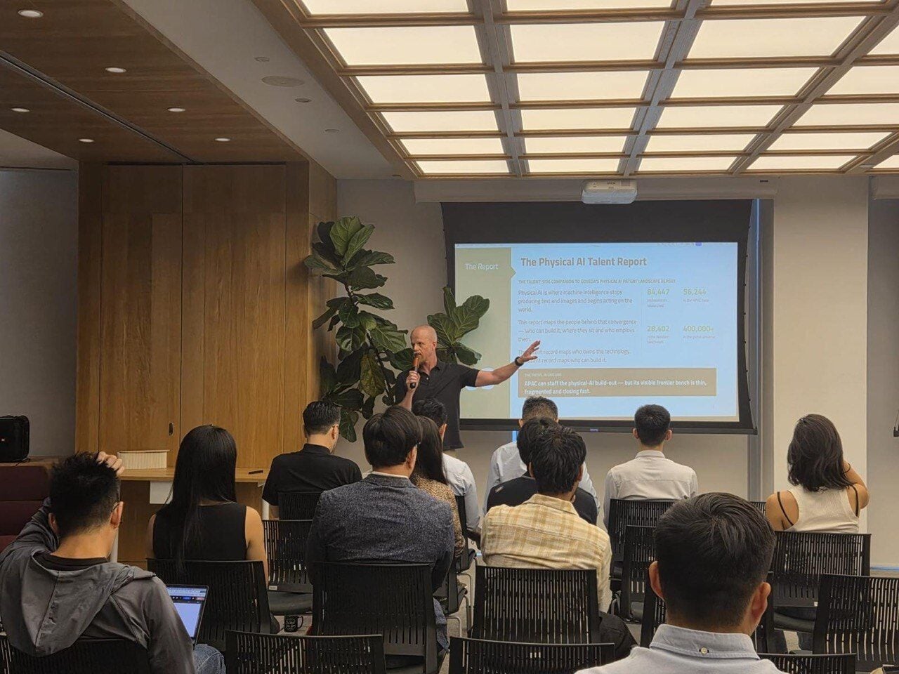 Roger Olofsson presenting The Physical AI Talent Report to a seated audience in Singapore, 13 August 2026