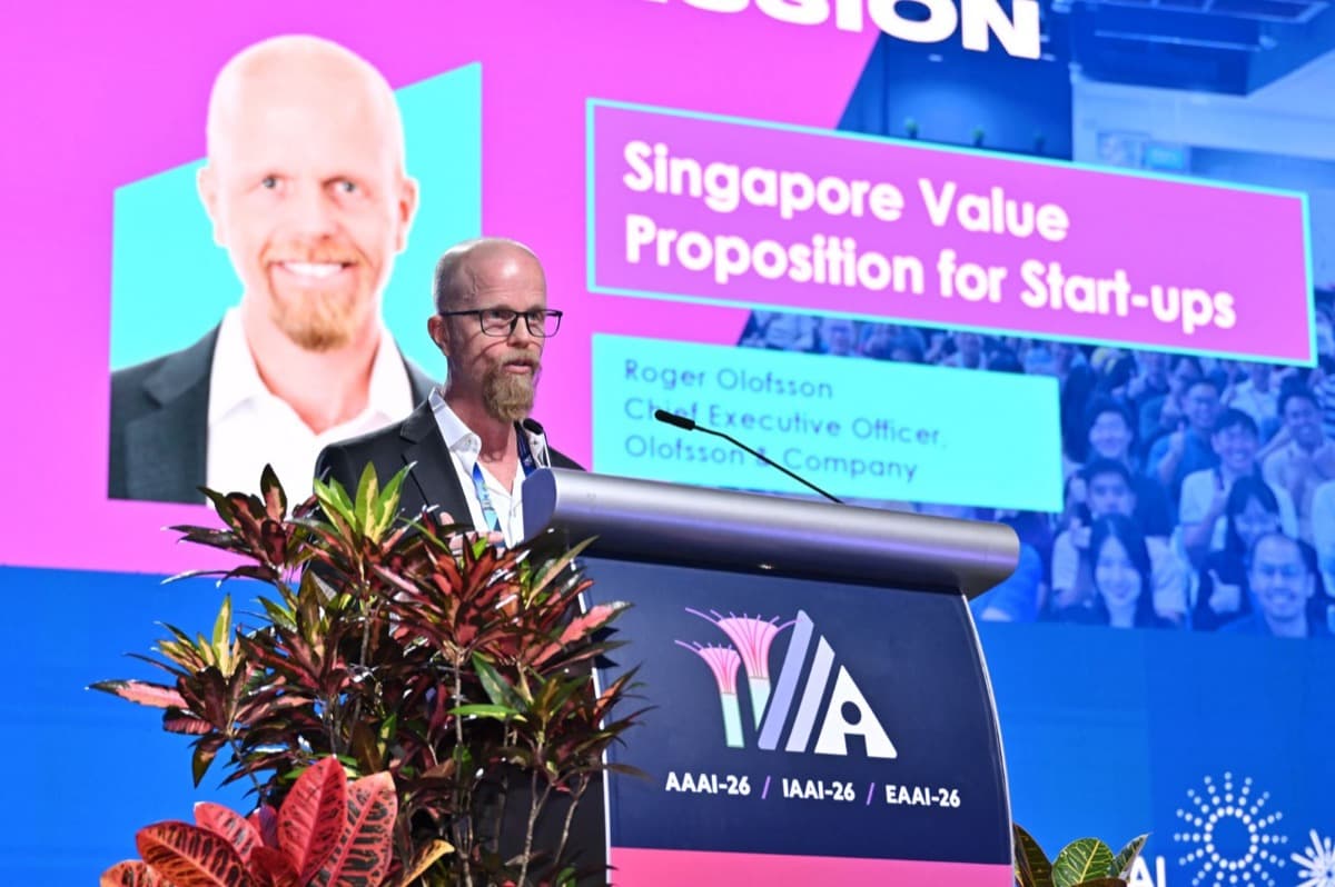 Roger Olofsson presenting Singapore's value proposition for start-ups on stage at AAAI-26